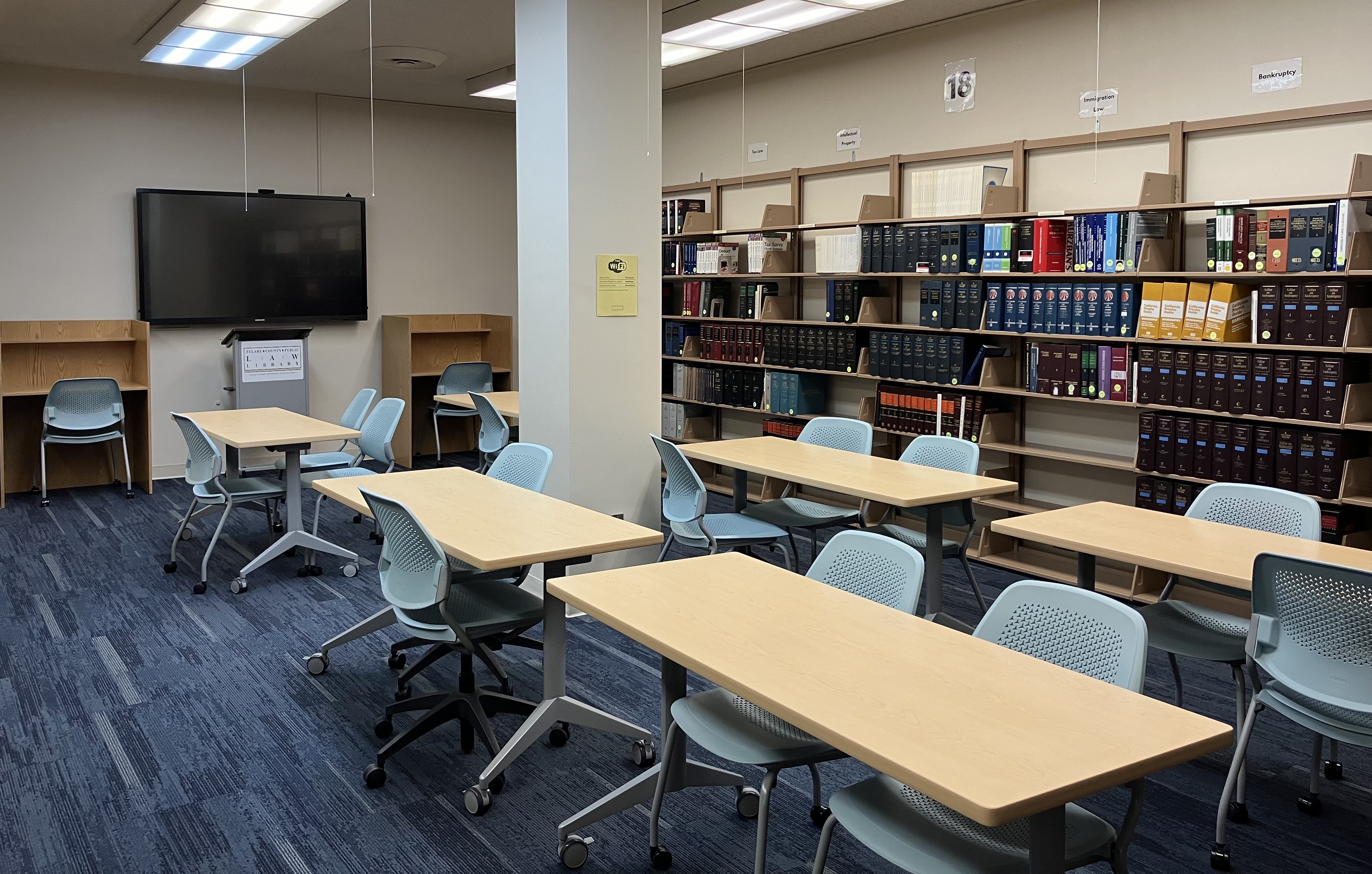 Picture of law library work space with tables and chairs.